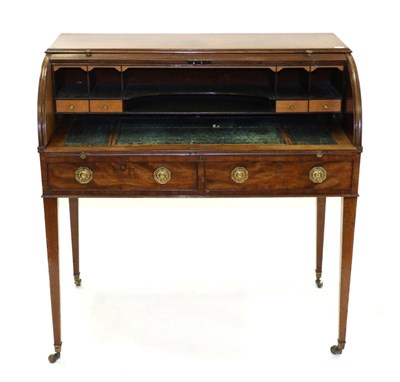 Lot 876 - A George III Mahogany Tambour Front Desk, circa 1800, the interior with a pull-out writing...