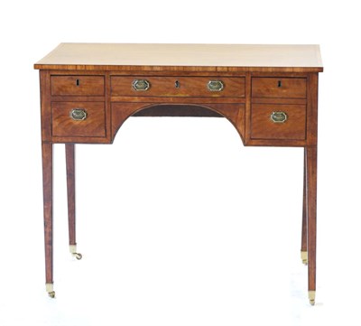 Lot 879 - A George III Satinwood and Crossbanded Kneehole Writing Table, circa 1800, with a long frieze...