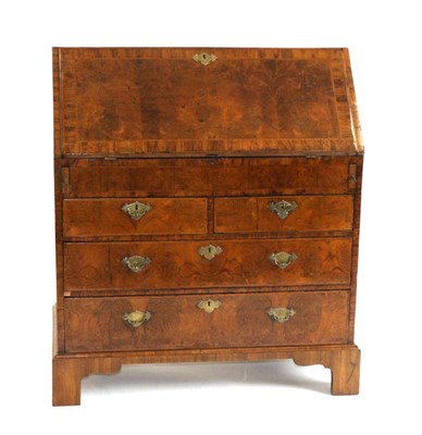 Lot 882 - A George I Walnut Crossbanded and Featherbanded Bureau, early 18th century, the fall enclosing...