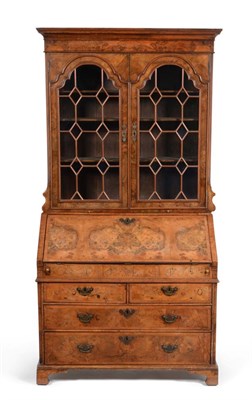 Lot 884 - A Figured Walnut and Crossbanded Bureau Bookcase, the upper section with astragal glazed doors...