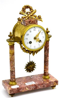 Lot 5132 - A French pink marble striking portico mantel clock