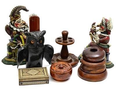 Lot 5135 - A group including, a Dunhill pipe stand, an ebonised and carved novelty wall mounted brush...