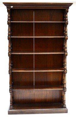 Lot 889 - A Victorian Mahogany Free-Standing Bookcase, mid 19th century, the bold pediment above six...