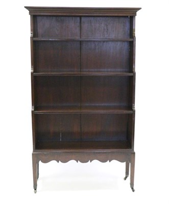 Lot 892 - A George III Mahogany Free-Standing Waterfall Bookcase, early 19th century, the bold pediment above