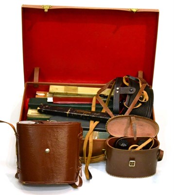 Lot 5180 - Small tan leather suitcase enclosing a quantity of measures and rules (some in original cases),...