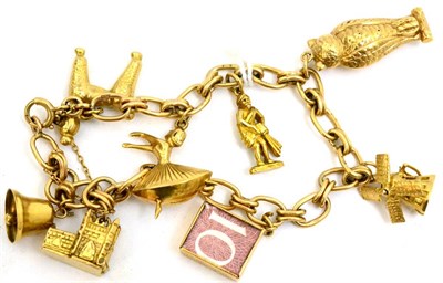 Lot 5187 - A 9ct gold charm bracelet with eight attached 9ct gold charms