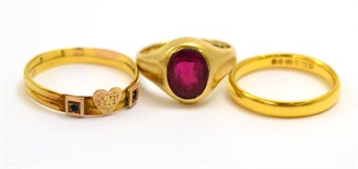 Lot 5188 - A 22ct gold band, a double band ring and a 9ct gold signet ring (3)