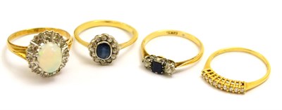 Lot 5190 - Four gemstone rings comprising a sapphire and diamond three stone ring, an 18ct gold diamond...