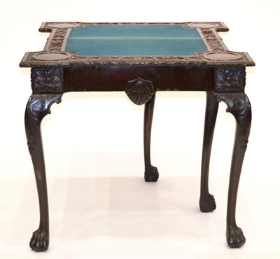 Lot 901 - A Carved Mahogany Foldover Card Table, in George I Irish style, labelled R Strahan & Co Ltd,...