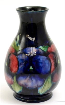 Lot 5252 - A William Moorcroft pansy pattern vase