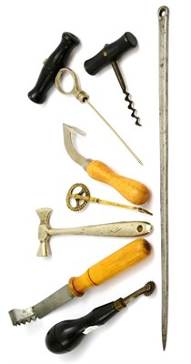 Lot 5268 - A group of curios including a 17th century style pastry cutter, toffee hammer, corkscrews,...