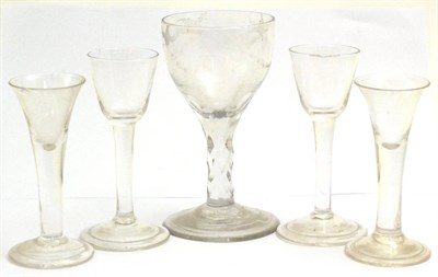 Lot 5271 - Four 18th century cordial glasses with fold over foot rims and a facet cut wine glass with engraved