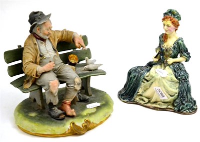 Lot 5289 - Capodimonte figure of a tramp and an M Rhodes earthenware figure of a lady