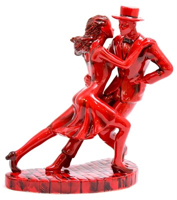 Lot 5303 - A ceramic figure modelled by Andy Moss, 'Rhythm and Romance', Ruby fusion