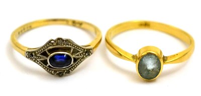 Lot 5318 - A sapphire and diamond ring (worn hallmark) and an aquamarine single stone ring (scuffed),...