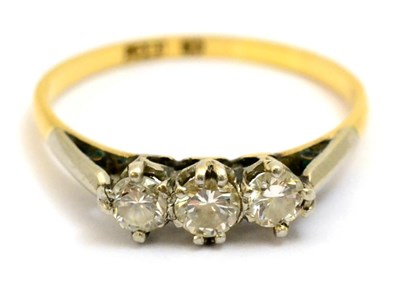 Lot 5322 - An 18ct gold three stone diamond ring