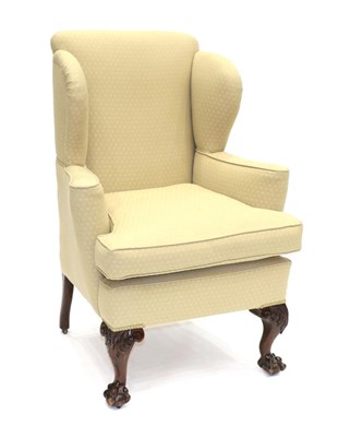 Lot 913 - A Victorian Wing-Back Armchair, 3rd quarter 19th century, recovered in beige fabric with...