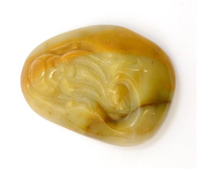 Lot 5353 - A jade-type pebble with a carving of a man's head, drilled for suspension at top edge