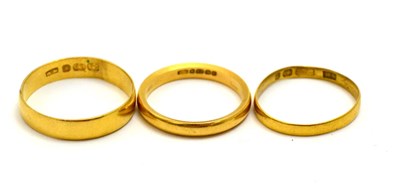 Lot 5361 - Three 22ct gold wedding bands