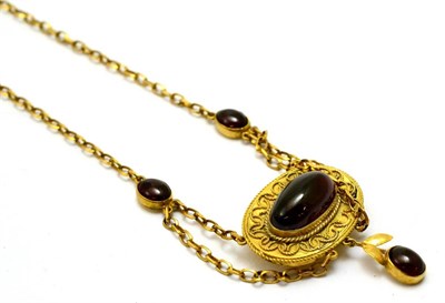 Lot 5362 - A cabochon garnet set necklace, the central panel inset with an oval cabochon garnet, within...