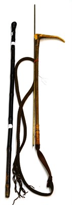 Lot 5366 - A 19th century Oriental bamboo walking cane carved with sinuous snake, brass barrel measuring stick