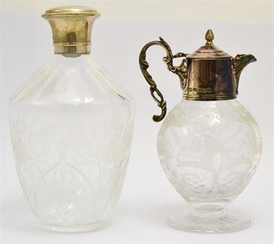 Lot 5400 - Two silver mounted glass vessels, one with a hinged cover and spout, the other with a stopper