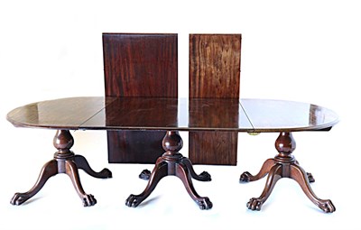 Lot 933 - A Victorian Mahogany Triple Pillar Dining Table, 3rd quarter 19th century, with two D ends and...