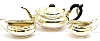 Lot 5441 - A George V silver tea set Chester, 1924, comprising a teapot, cream jug and sugar bowl, makers mark