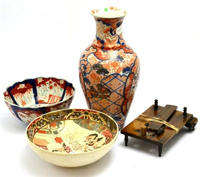 Lot 5476 - A Japanese Imari vase together with an Imari bowl, a Satsuma bowl and a Chinese wooden stand