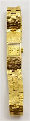 Lot 5500 - A Bueche Girod 9ct gold wristwatch, with integrated gold bracelet