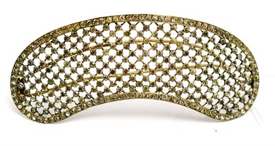 Lot 5519 - A hair ornament, of curved form, with white paste stones inset in grid fashion linked by fine bars