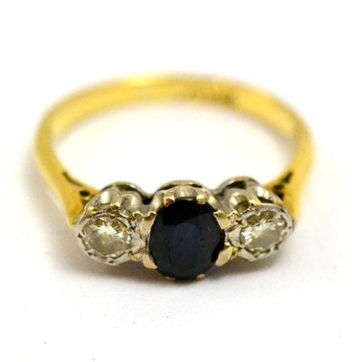 Lot 5531 - A sapphire and diamond ring, stamped '18CT'