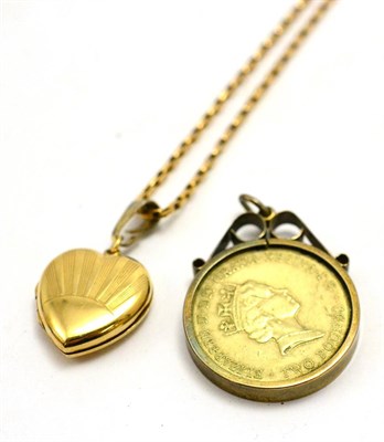 Lot 5532 - A 9ct gold heart locket and a £2 coin pendant