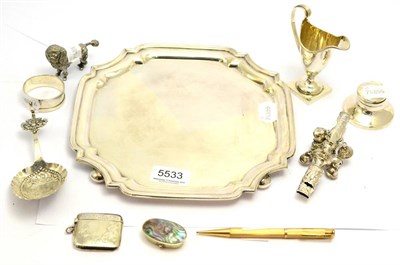 Lot 5533 - A quantity of silver including square card tray on bun feet, a helmet shaped cream jug, silver...