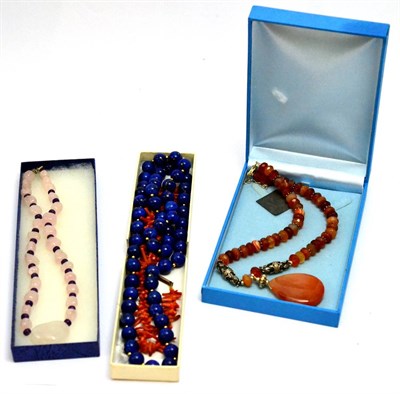 Lot 5539 - Lapis lazuli necklace, coral necklace and two others