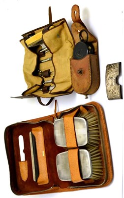 Lot 5598 - Gentlemen's silver mounted brush set and comb in a fitted leather case, compass in leather...