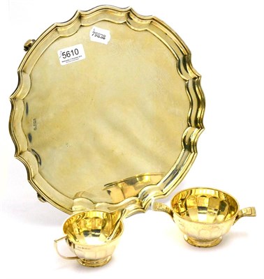 Lot 5610 - A silver salver, Sheffield, together with an Art Deco silver cream and sugar