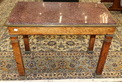 Lot 958 - A Charles X Maplewood Table-de-Milleu, early 19th century, with an Egyptian red porphyry slab...