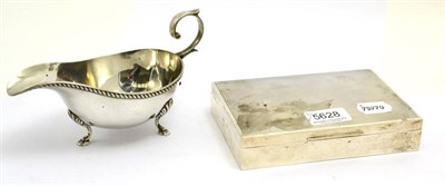 Lot 5628 - A silver sauce boat and a silver cigarette box