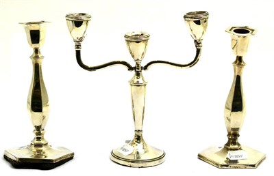 Lot 5645 - A pair of silver candlesticks and a silver candelabra (a.f.)