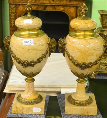 Lot 5649 - A pair of marble urns