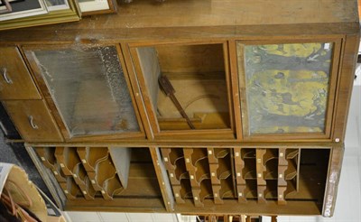 Lot 6009 - An early 20th century haberdashery cabinet together with a similar glazed cabinet (2)