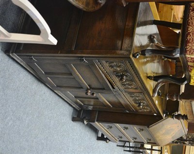 Lot 6015 - A 1920's carved oak sideboard together with an oak bureau of similar date (2)