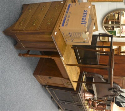 Lot 6030 - An oak pedestal desk with single drawer and cupboard on a plinth base, an oak chest of drawers with