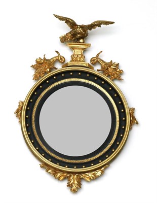 Lot 966 - A Regency Carved Giltwood and Gesso Convex Mirror, early 19th century, with an ebonised slip within