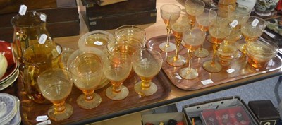 Lot 6064 - A quantity of 1920's amber glass including wines, jugs, finger bowls etc (on two trays)