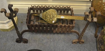 Lot 6139 - An ornate fire grate, together with three fire implements (4)