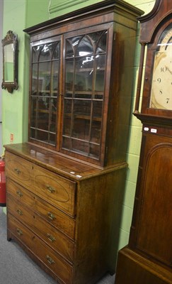 Lot 6262 - A Georgian mahogany secretaire bookcase with glazed top