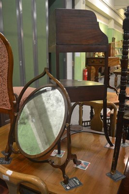 Lot 6288 - A 19th century mahogany washstand and a mahogany oval swing mirror