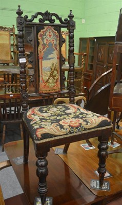 Lot 6289 - A carved oak hall chair